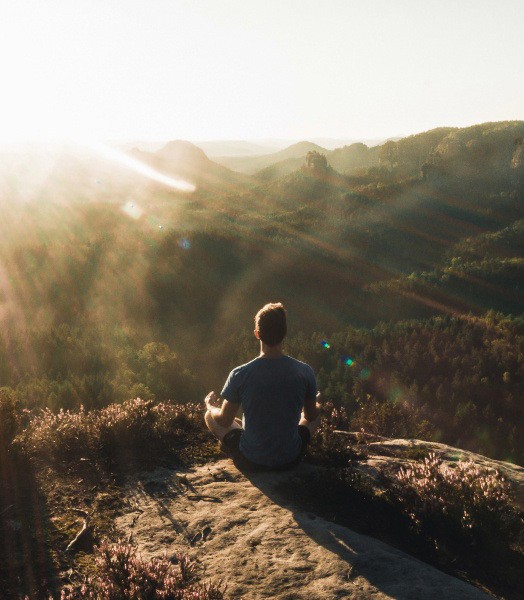 Man sitting on a mountain